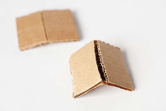 DIY cardboard building with revolving door - from All for the Boys blog