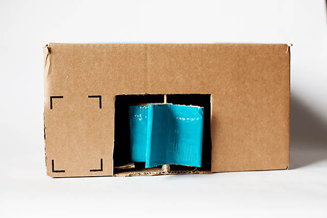 DIY cardboard building with revolving door - from All for the Boys blog