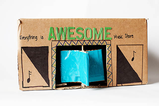 DIY cardboard building with revolving door - from All for the Boys blog