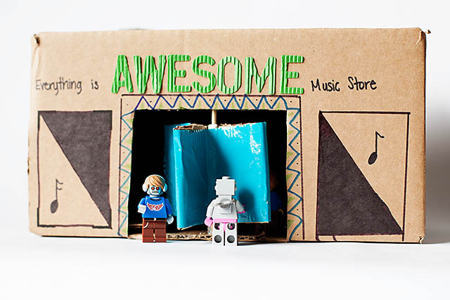 DIY cardboard building with revolving door - from All for the Boys blog