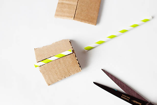 DIY cardboard building with revolving door - from All for the Boys blog