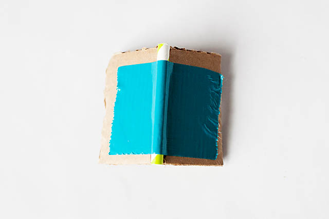 DIY cardboard building with revolving door - from All for the Boys blog