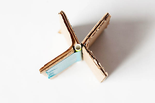 DIY cardboard building with revolving door - from All for the Boys blog