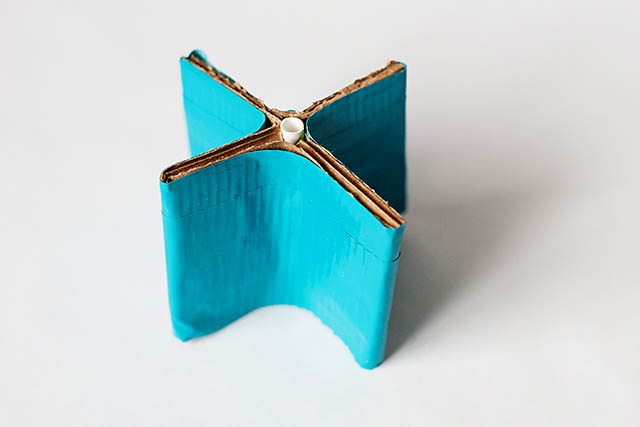 DIY cardboard building with revolving door - from All for the Boys blog