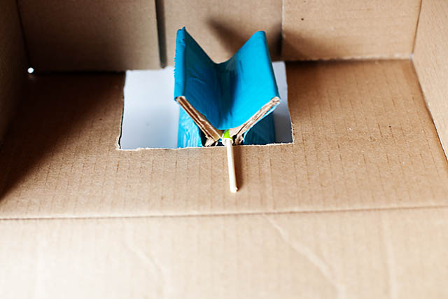 DIY cardboard building with revolving door - from All for the Boys blog