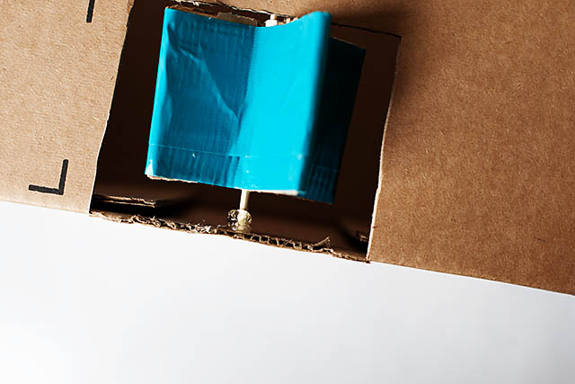 DIY cardboard building with revolving door - from All for the Boys blog