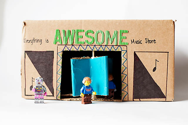 DIY cardboard building with revolving door - from All for the Boys blog