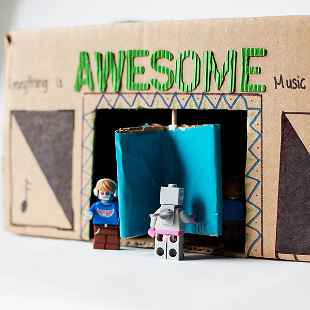 DIY cardboard building with revolving door - from All for the Boys blog
