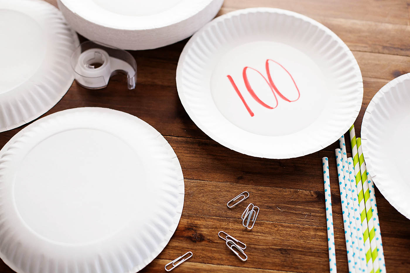 Paper plate targets and rubber band bracelet bow and arrow