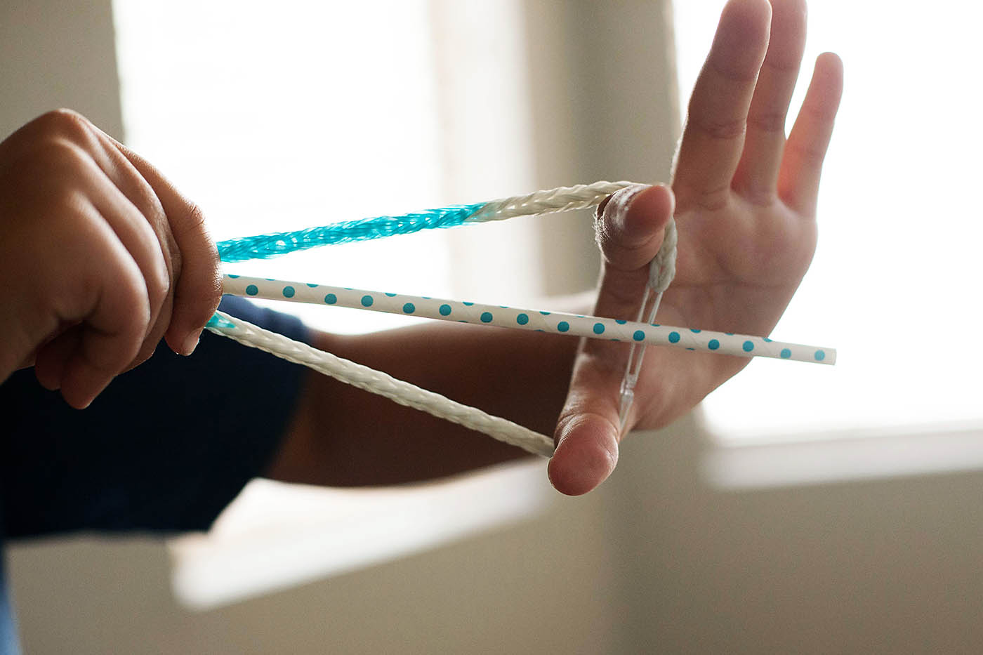 Paper plate targets and rubber band bracelet bow and arrow
