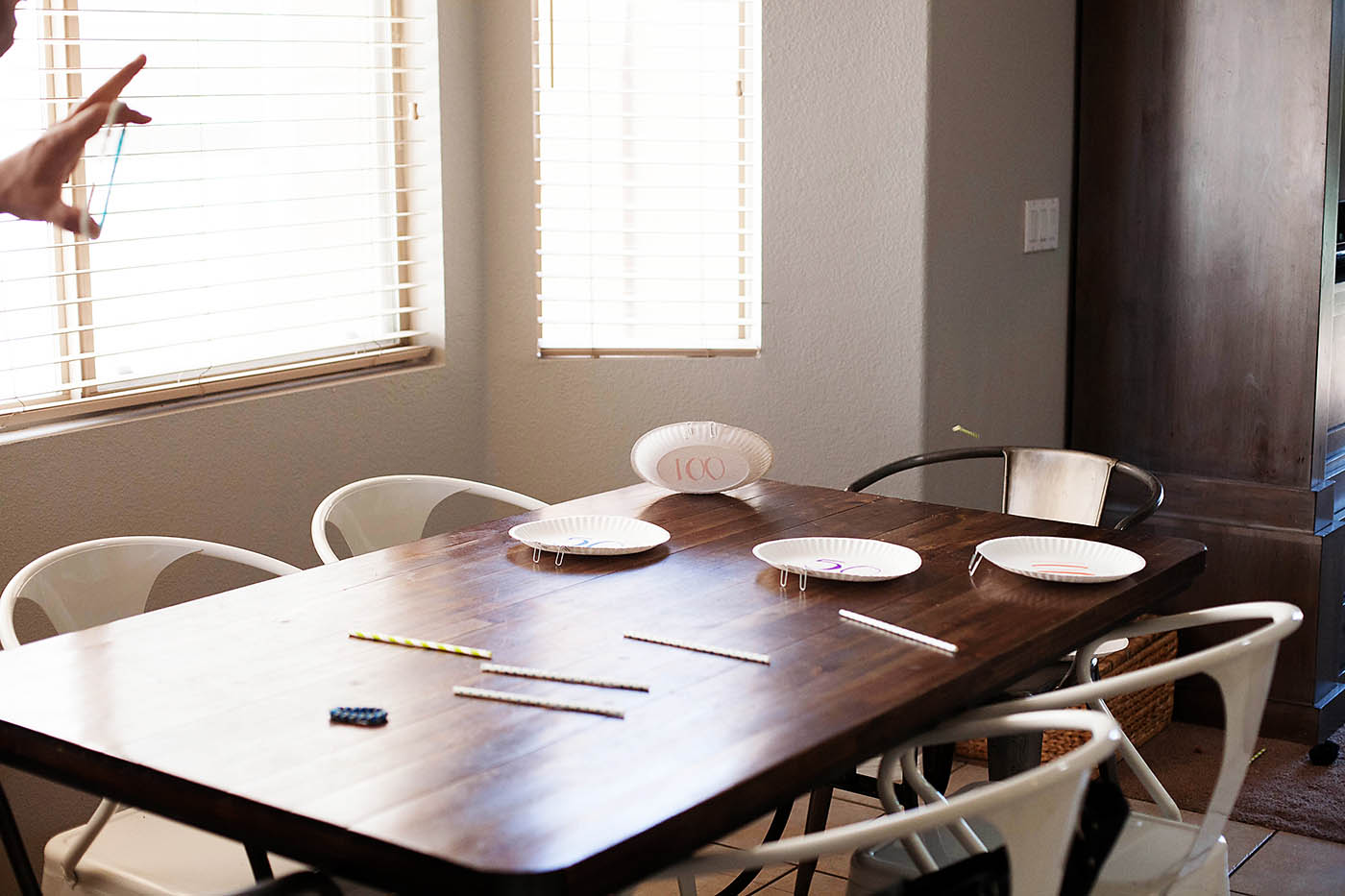 Paper plate targets and rubber band bracelet bow and arrow