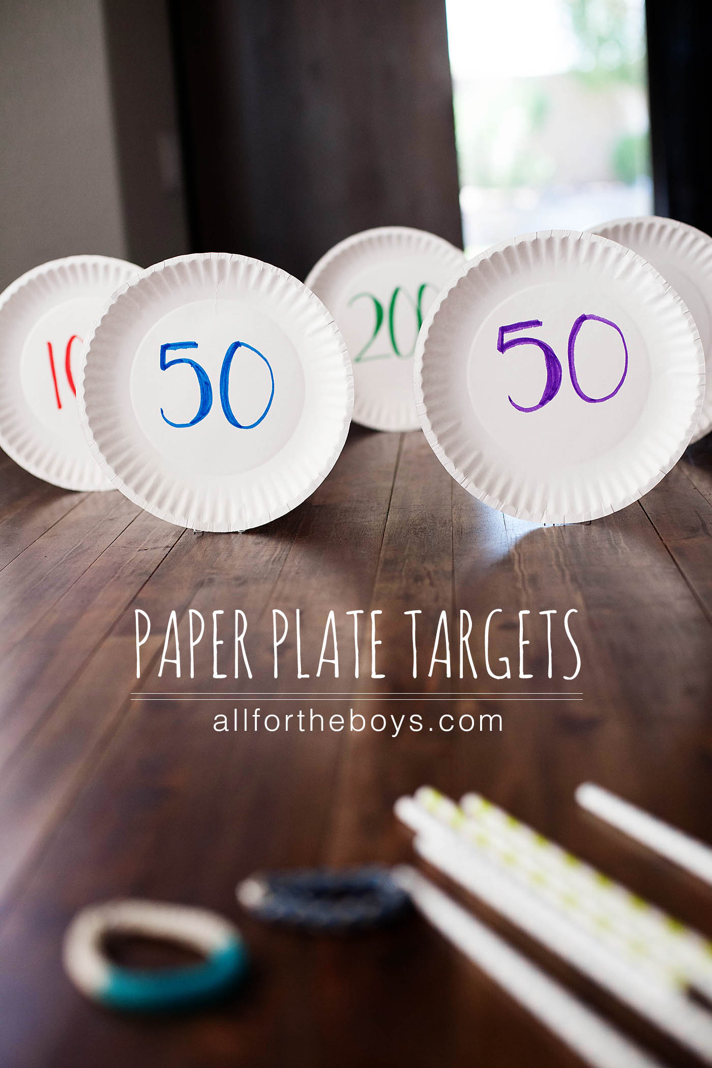 Paper plate targets and rubber band bracelet bow and arrow