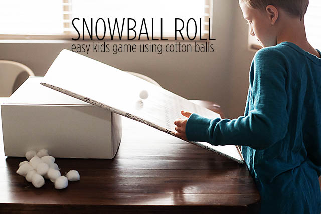 Snowball roll game using cotton balls from All for the Boys blog