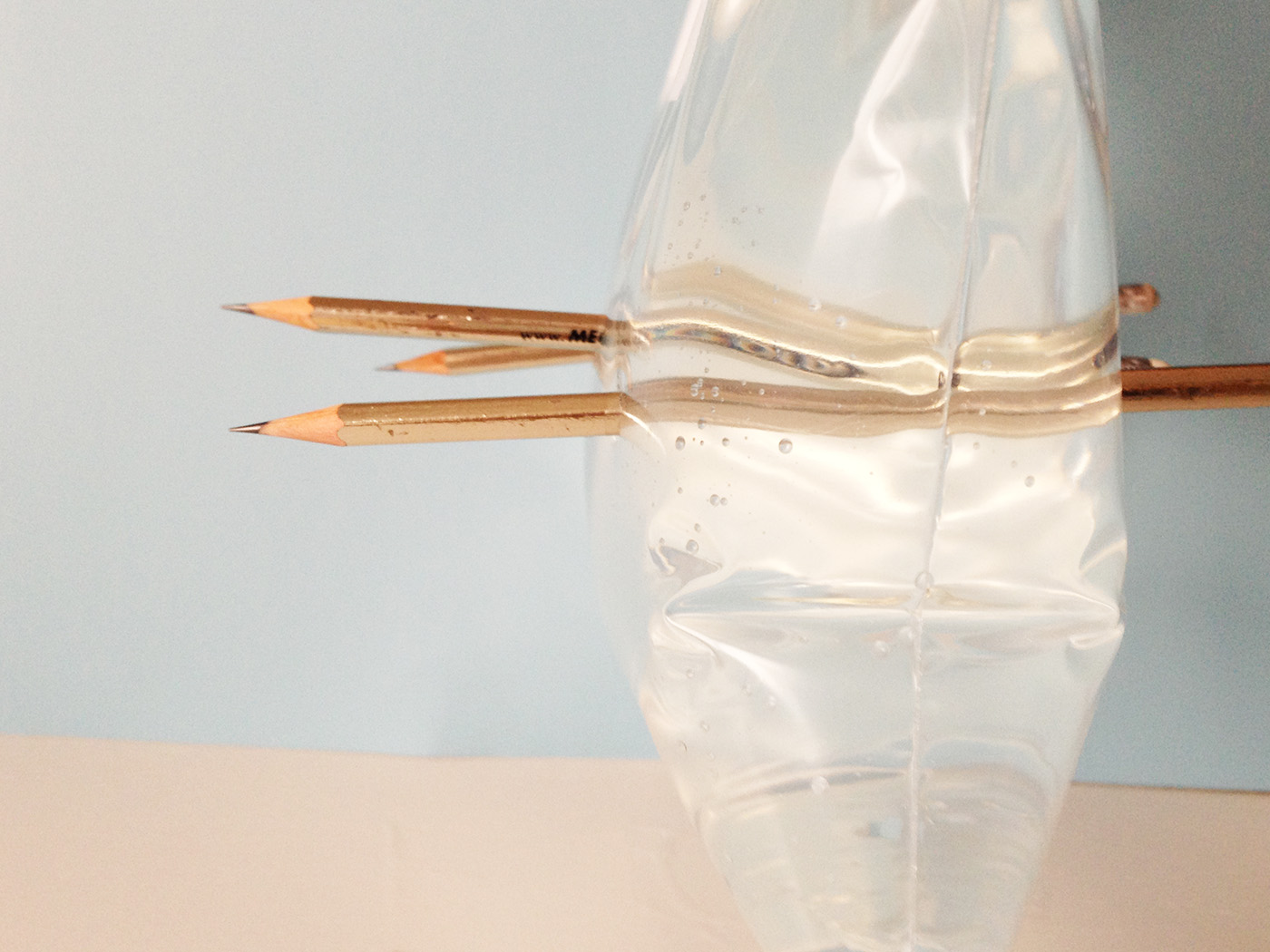 Poking pencils through a plastic bag