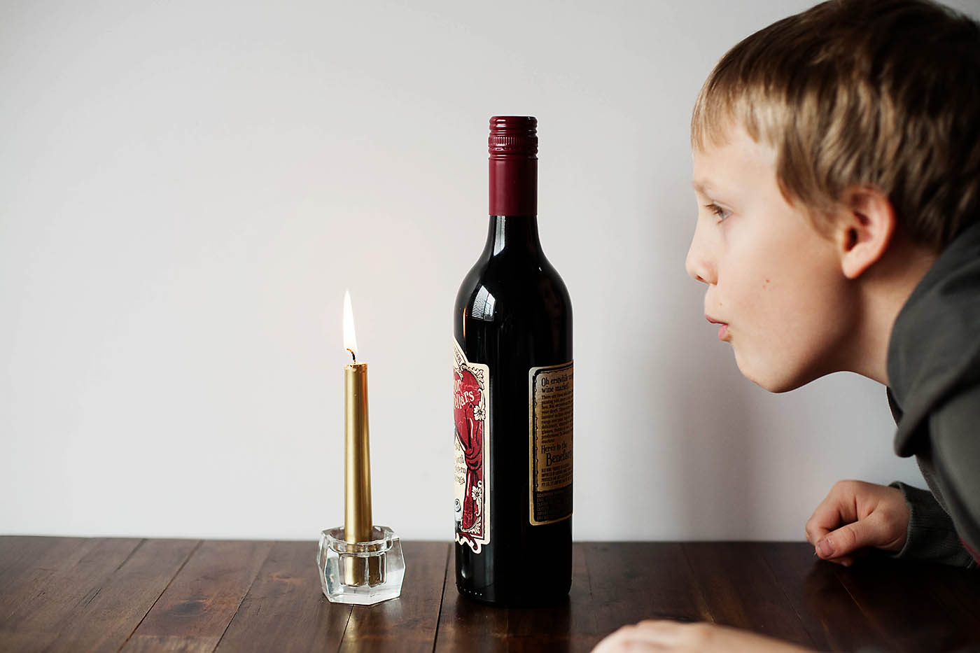 Can you blow out a candle through a bottle?