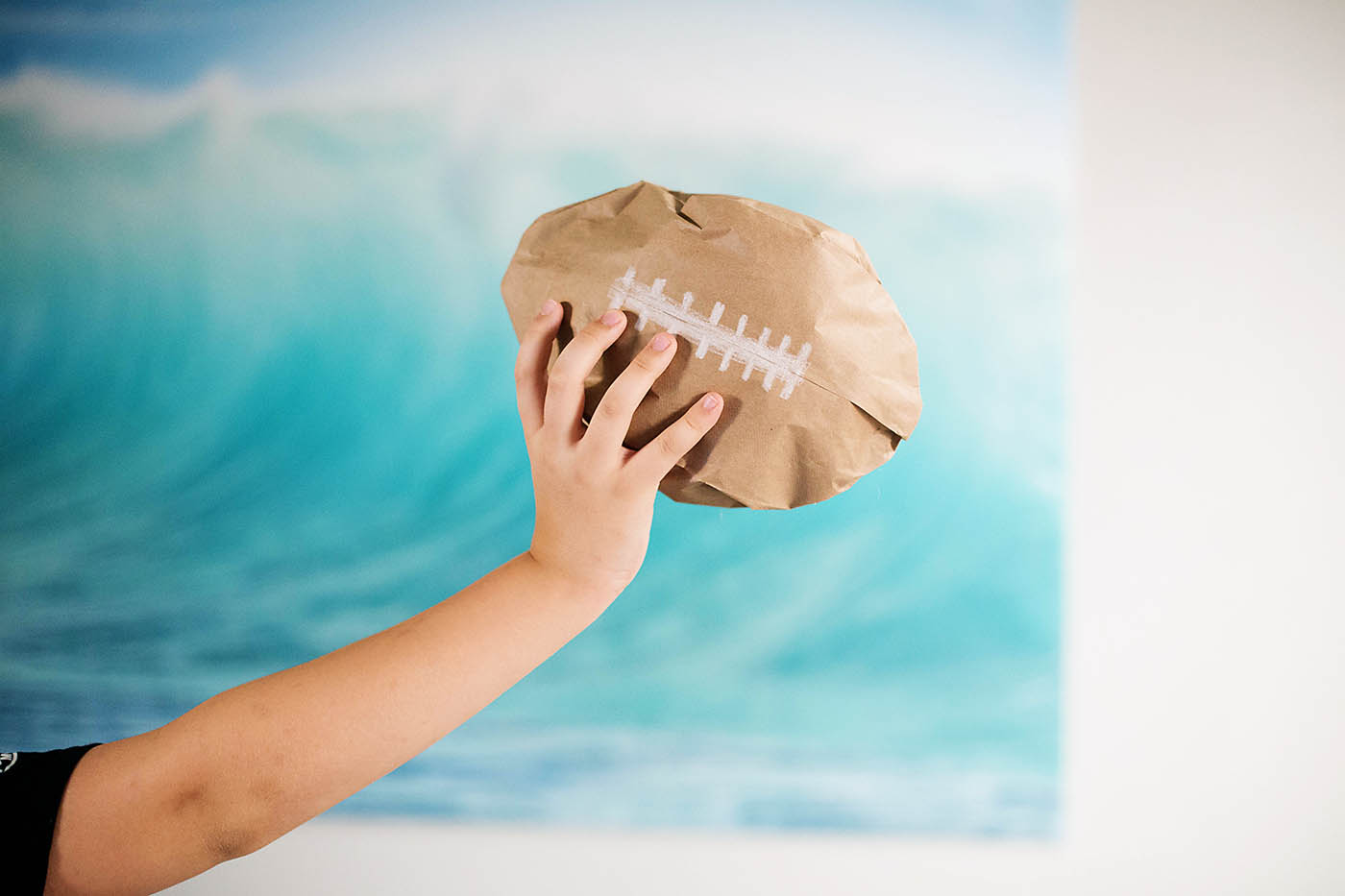 Paper bag football craft for kids 