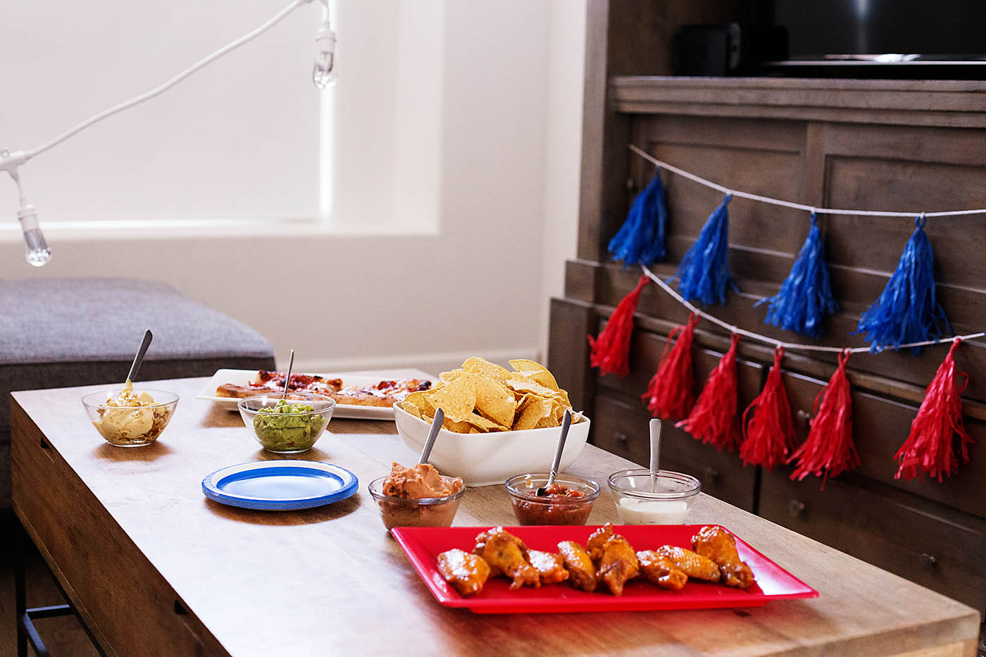 Homegating (a tailgating party at home) made easy with lights that change to your team’s colors and simple food favorites!